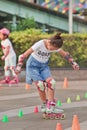 Lovely Chinese girl practicing inline skating, Beijing, China